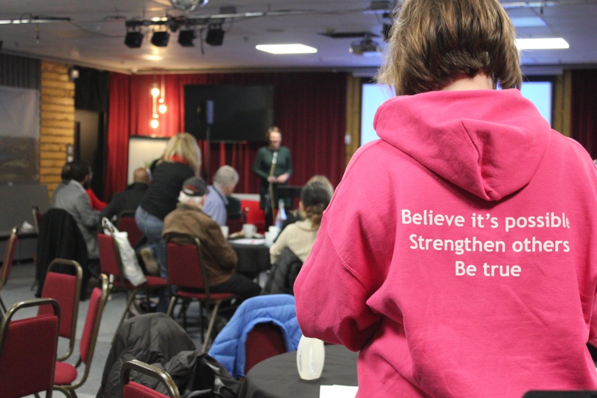 Photo of the back of an Action Together hoodie