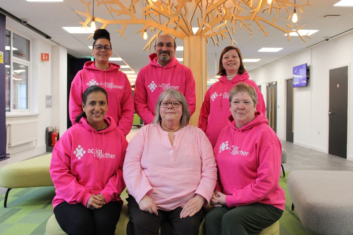 Group of people in pink jumpers