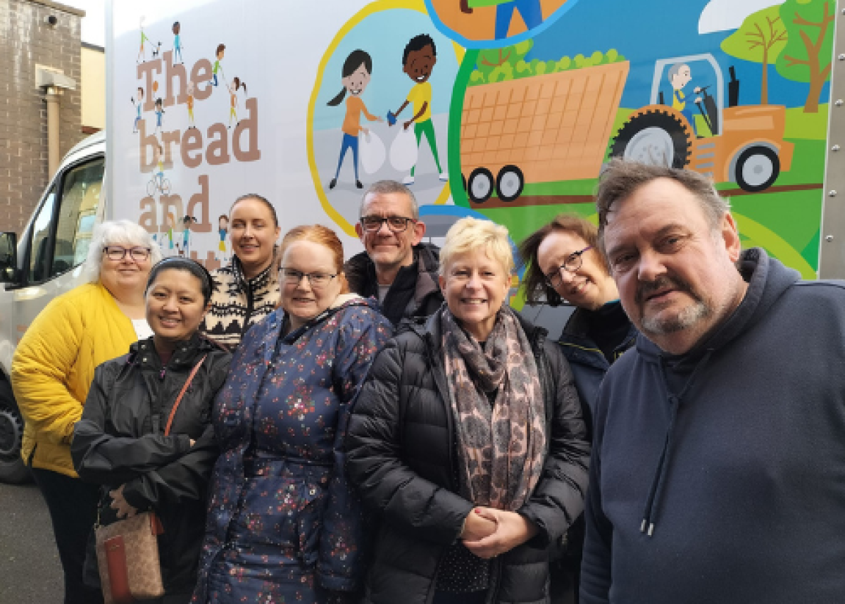 group of women in front of delivery van saying 'the bread and butter thing'