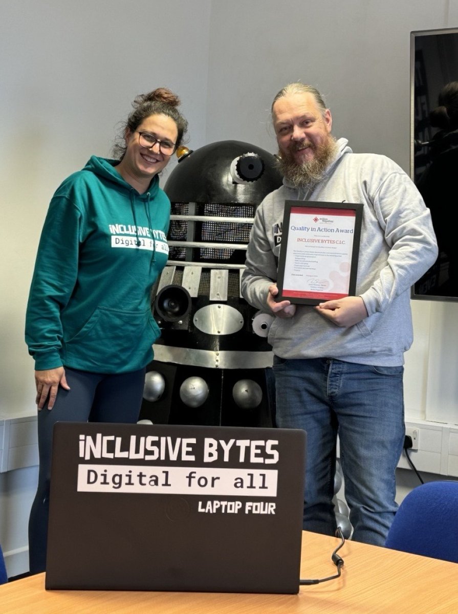 Inclusive Bytes team holding QiAA Certificate