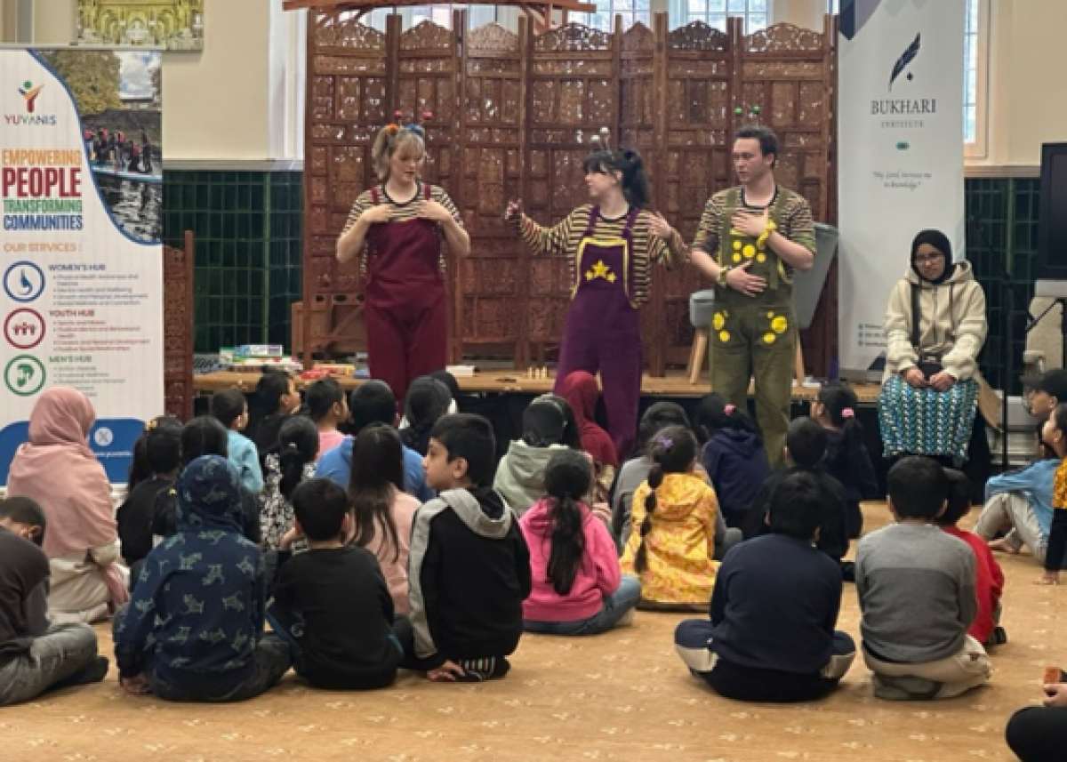 group of children sat on floor watching children's entertainers