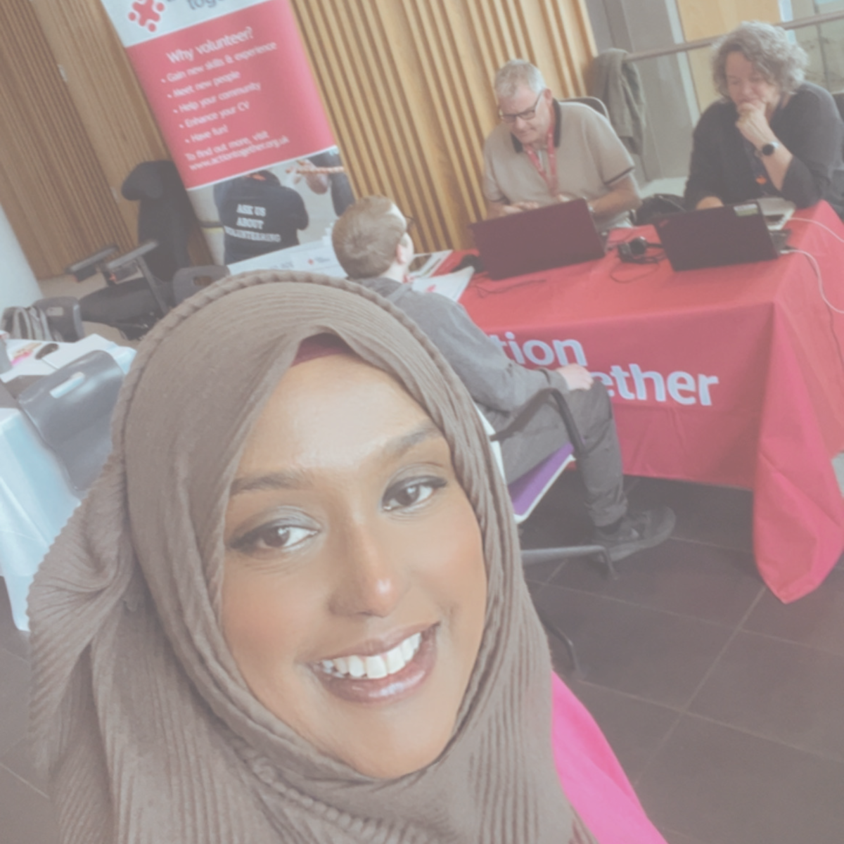 Volunteer Officers Asma and Phil at Action Together stand in Number One Riverside