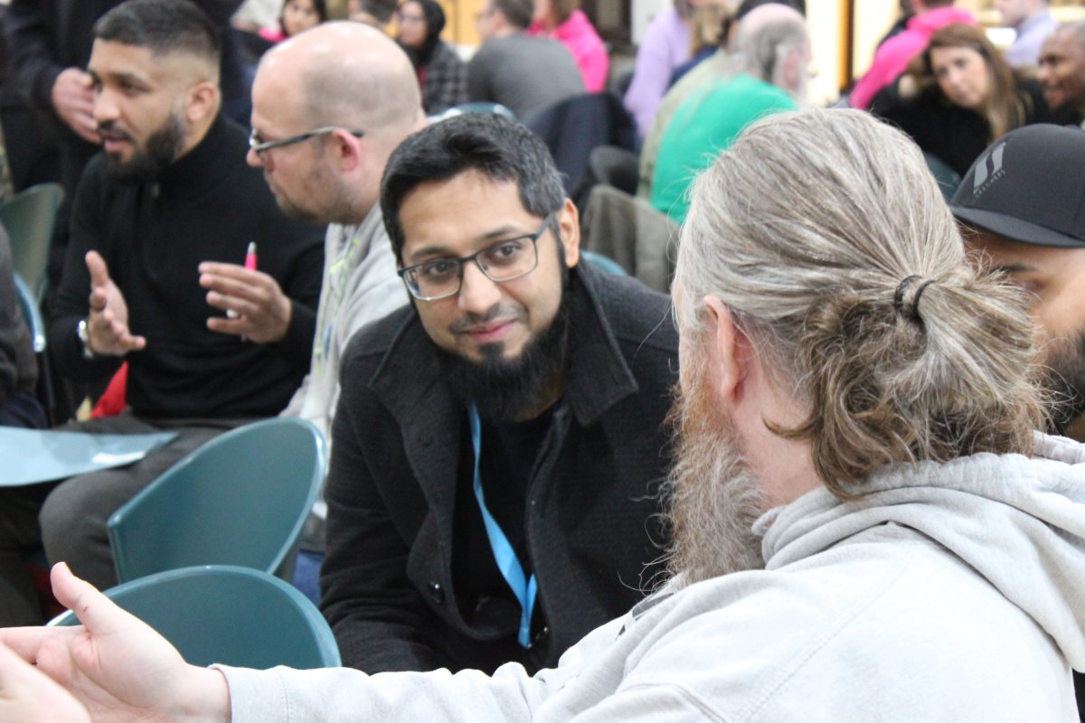 Two AGM attendees talking