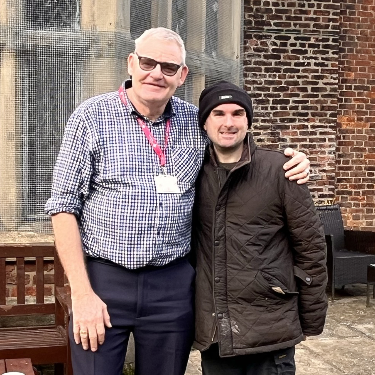 Two men smiling - Phil and volunteer Jon