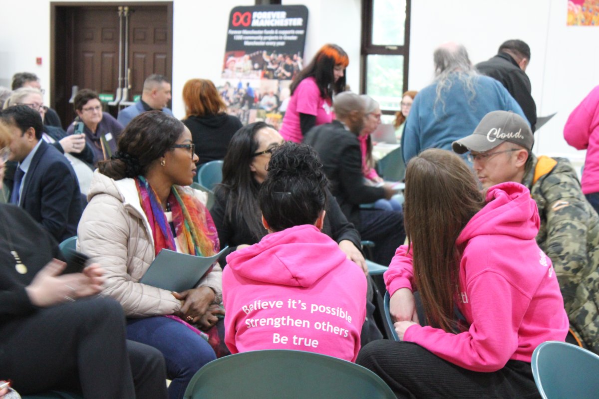 AGM attendees speaking to each other in a workshop