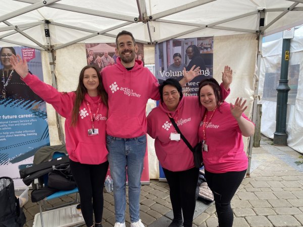 Volunteer team waving